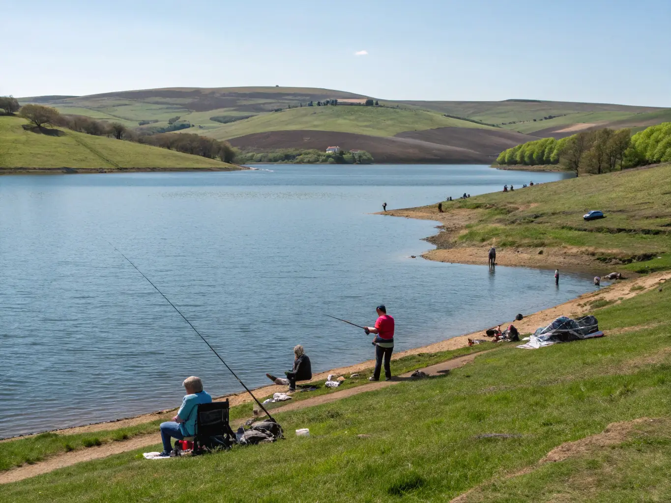 A serene image of a family enjoying a leisurely day of fishing at L'ETANG AMICUS, highlighting the recreational aspect of the club.